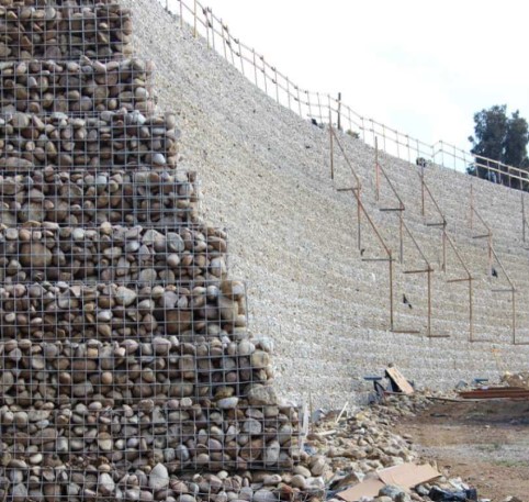 Gabion walls built using geogrid mesh boxes